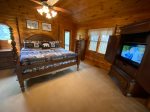 Open Loft Master Bedroom with a king bed, TV and a private screened porch
